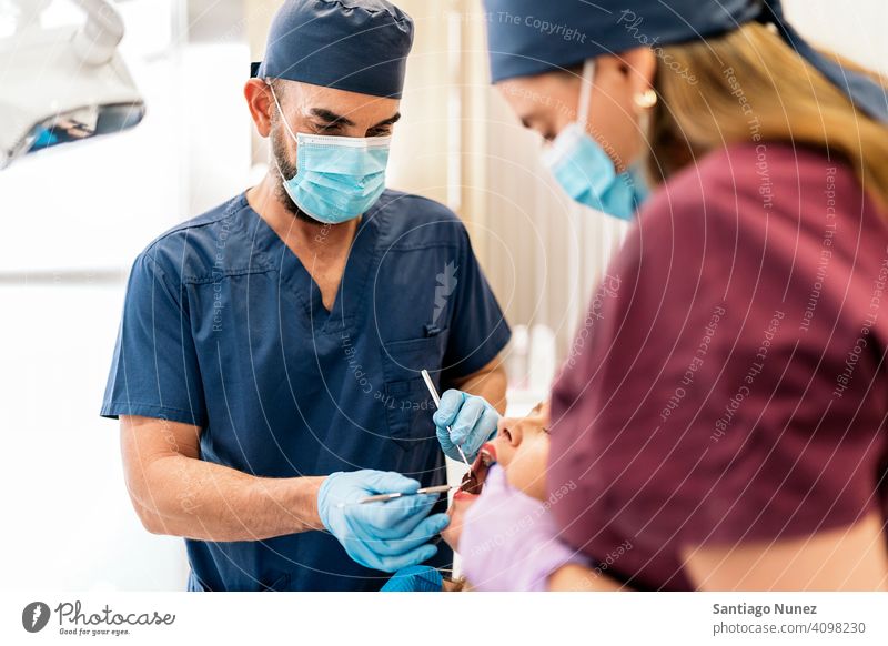 Patient During Dentist Visit man woman patient standing looking examining side view dentist clinic dental clinic lying health care equipment medicine medical