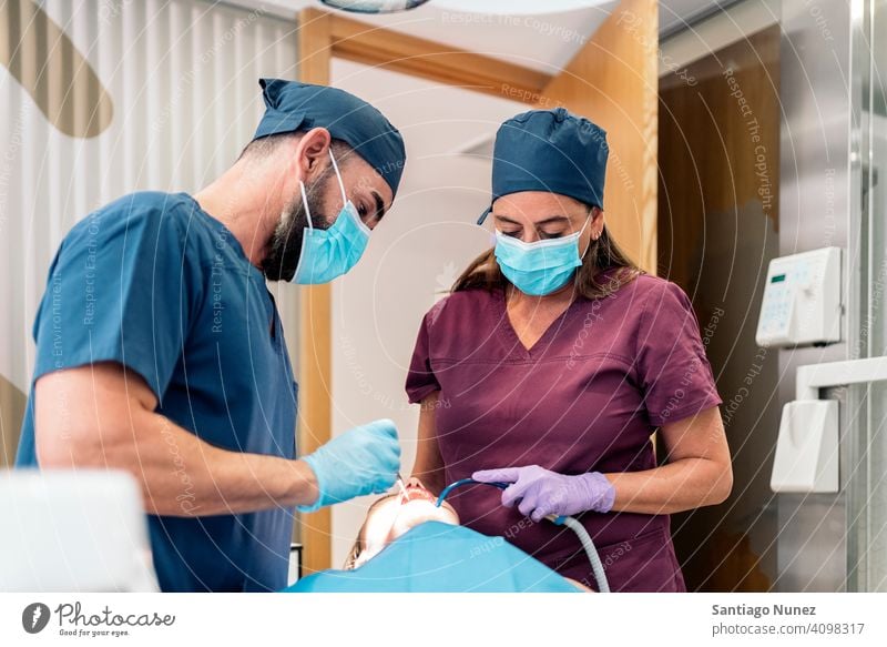 Dental Clinic Workers front view man woman patient standing looking examining dentist clinic dental clinic lying health care equipment medicine medical