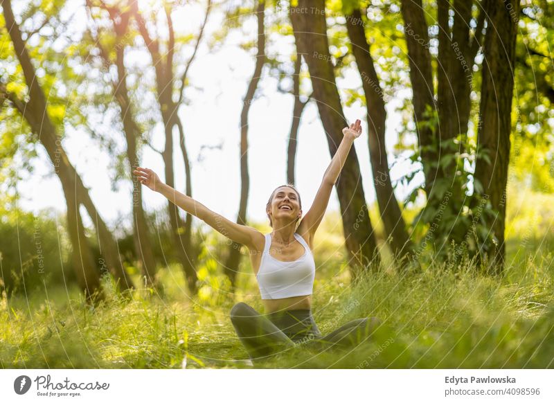 Fit young woman exercising in nature natural girl people female recreation healthy wellbeing lifestyle active vitality outdoors adult outside attractive