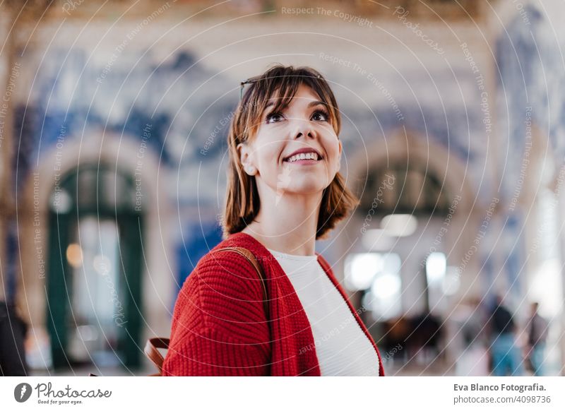 beautiful caucasian woman in train station waiting to travel. Travel and lifestyle concept city public transport boards young trip screen passenger wagon