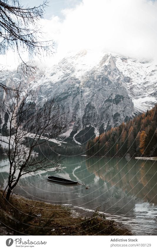 Beautiful lake and mountains pine tree forest sky wooden bridge nature rock landscape track vacation blue travel tourism destination sightseeing view dolomites