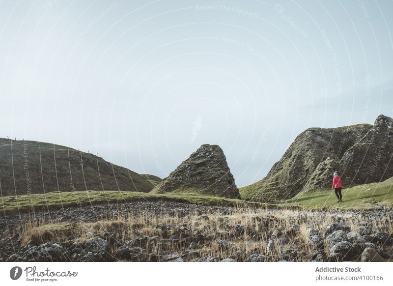 Woman walking along mountain woman rock landscape cliff highland scenic female ballintoy antrim northern ireland townland picturesque island adventure altitude