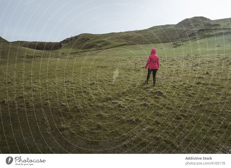 Woman walking along mountain woman rock landscape cliff highland scenic female ballintoy antrim northern ireland townland picturesque island adventure altitude