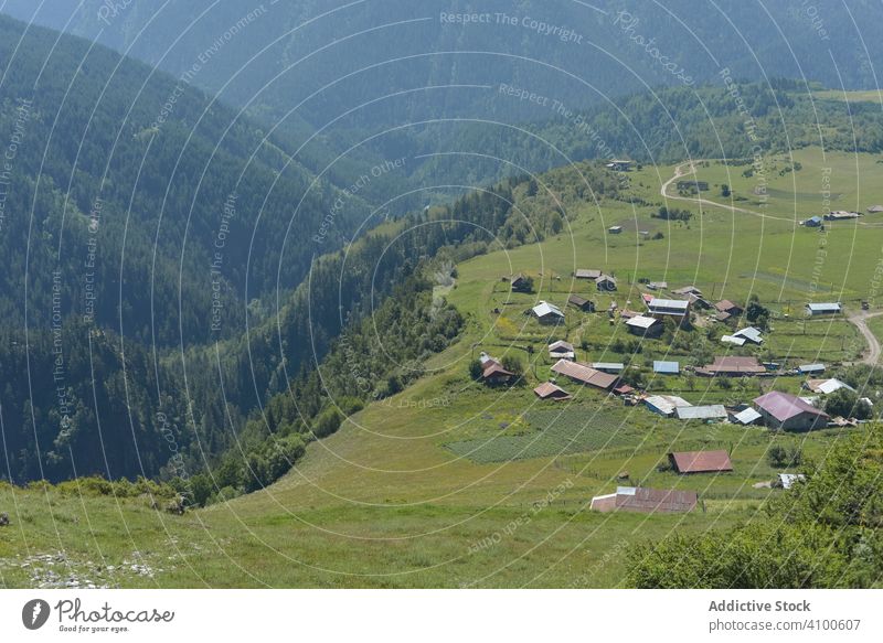 Wonderful view of countryside against picturesque highland village valley mountain rustic rural house nature freedom tranquil crest scenic hill adventure fresh