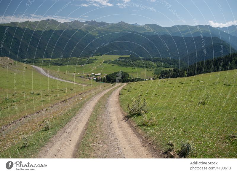 Wonderful view of countryside against picturesque highland village valley mountain rustic rural house nature freedom tranquil crest scenic hill adventure fresh