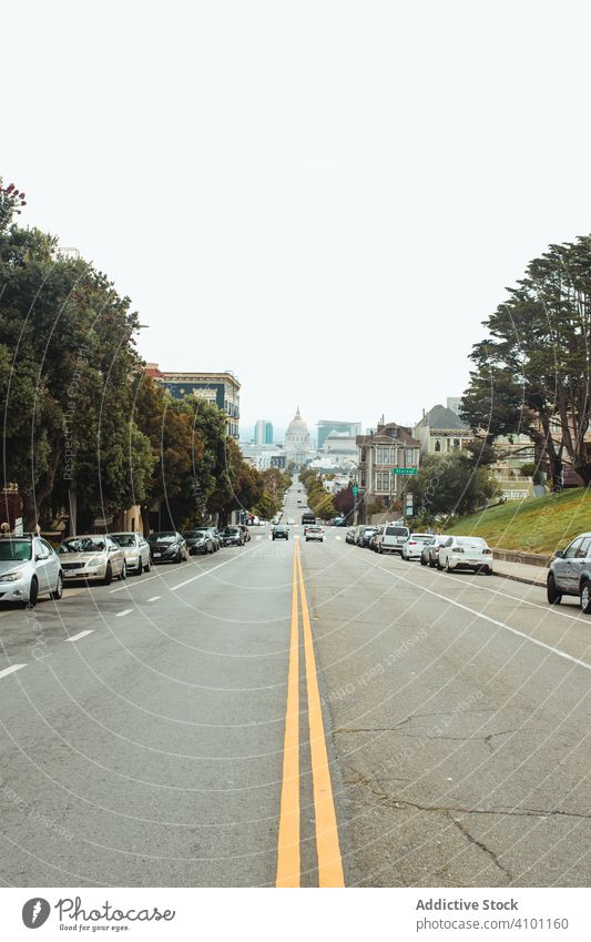 Yellow marking strip in middle of city road stripe yellow transport traffic transportation car san francisco building cityscape travel town boundary highway