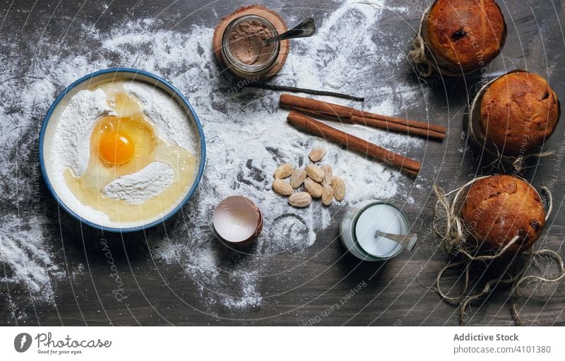 Ingredients for Christmas cake recipe on table powdered with flour ingredient panettone bake bread christmas dessert food preparation egg bakery homemade