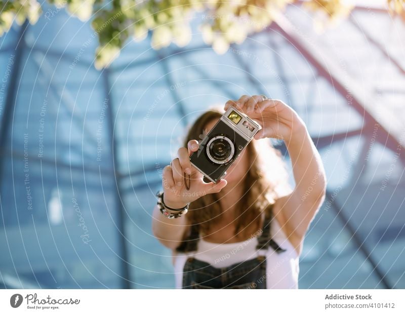 Woman taking picture with camera woman taking photo photo camera young analog photography hold portable mini photographer activity female capture film lens