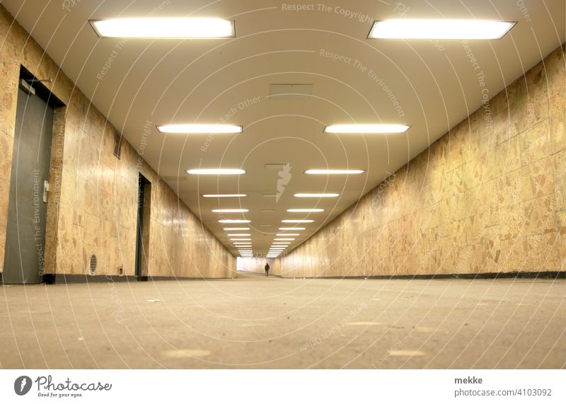 Illuminated clean station tunnel in Berlin Marzahn Underpass Tunnel Train station Town Transport Lanes & trails Tunnel vision Empty Architecture Underground