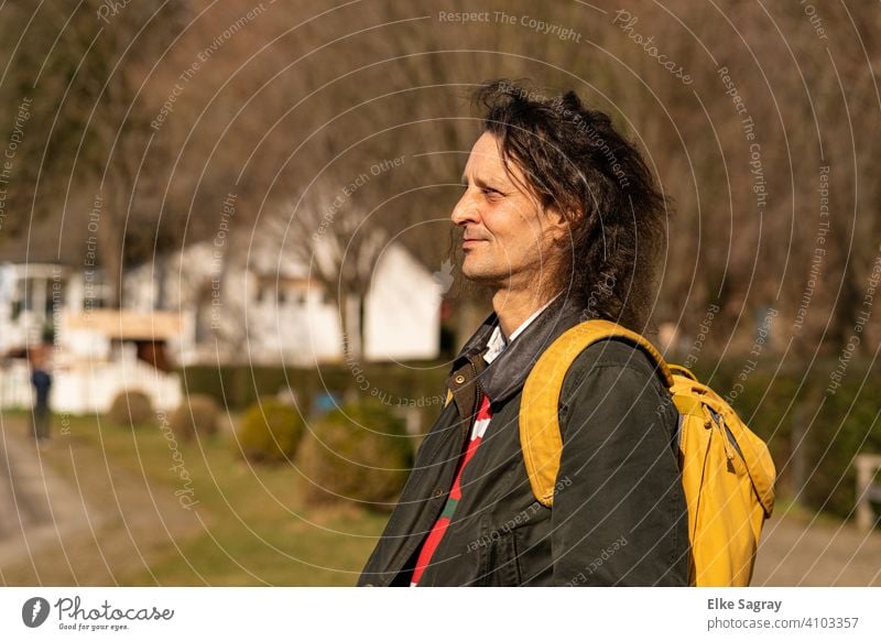 young man pages -profile- blurred background man alone 1 Person One young adult man Day Colour photo Exterior shot 40-50 years Man long hairs hair in the wind