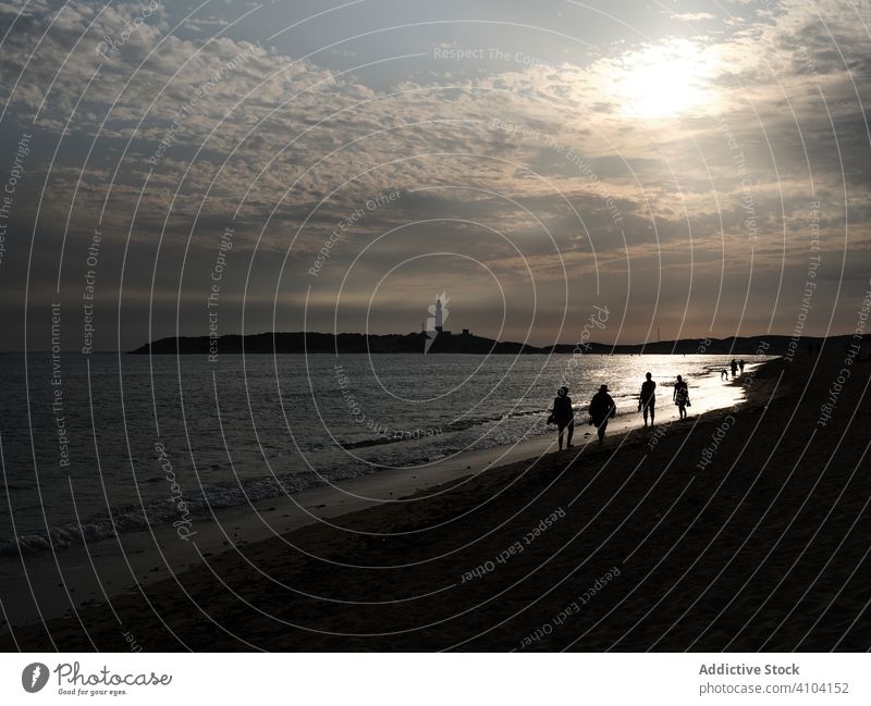 People on beach in sunset time people silhouette sea summer vacation travel ocean leisure outdoors water sky coast freedom evening romantic tranquility shore