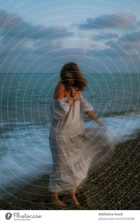 Female tourist seaside woman beach waves barefoot seashore sky heaven dusk clouds female lady walking coastline empty lonely blue dress beautiful vacation water