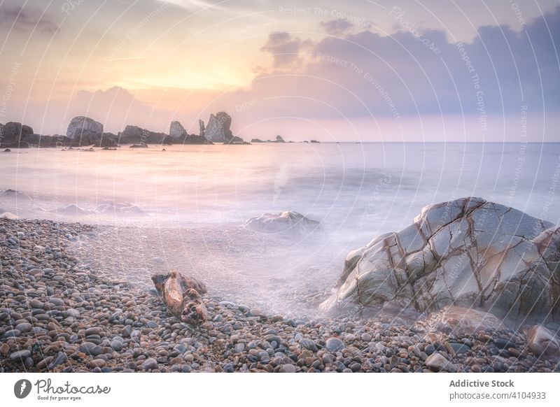 Waves washing over rocks against cloudy sky wave water sea cliff landscape beach nature long exposure coast travel spain asturias tropical season summer scenic