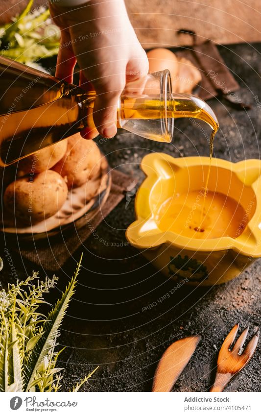 Faceless cook pouring oil in bowl woman kitchen food table meal lifestyle dish female prepare occupation nutrition eat gourmet delicious tasty cuisine