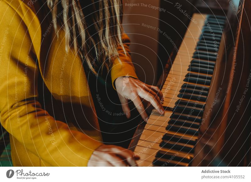 Hipster millennial woman playing piano dreadlocks hipster music stylish sit female focused concentrated practicing musician instrument art pianist melody key