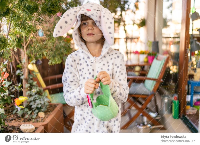 Easter Egg hunt on a balcony eggs Easter eggs egg hunt Easter hunt house indoors family home people happy happiness children kid kids girl little small cute