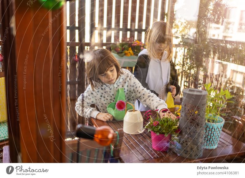 Easter Egg hunt on a balcony eggs Easter eggs egg hunt Easter hunt house indoors family home people happy happiness children kid kids girl little small cute