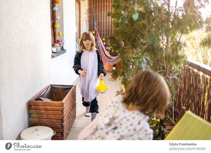 Easter Egg hunt on a balcony eggs Easter eggs egg hunt Easter hunt house indoors family home people happy happiness children kid kids girl little small cute