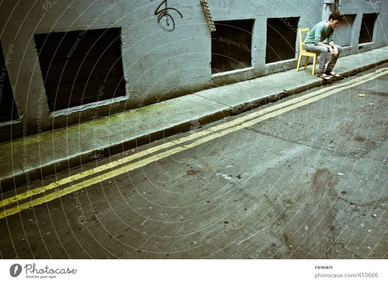 At the edge Human being Masculine Young man Youth (Young adults) Man Adults 1 Dark Individual Loneliness Chair Yellow Sit Street Sidewalk Exclusion Sadness