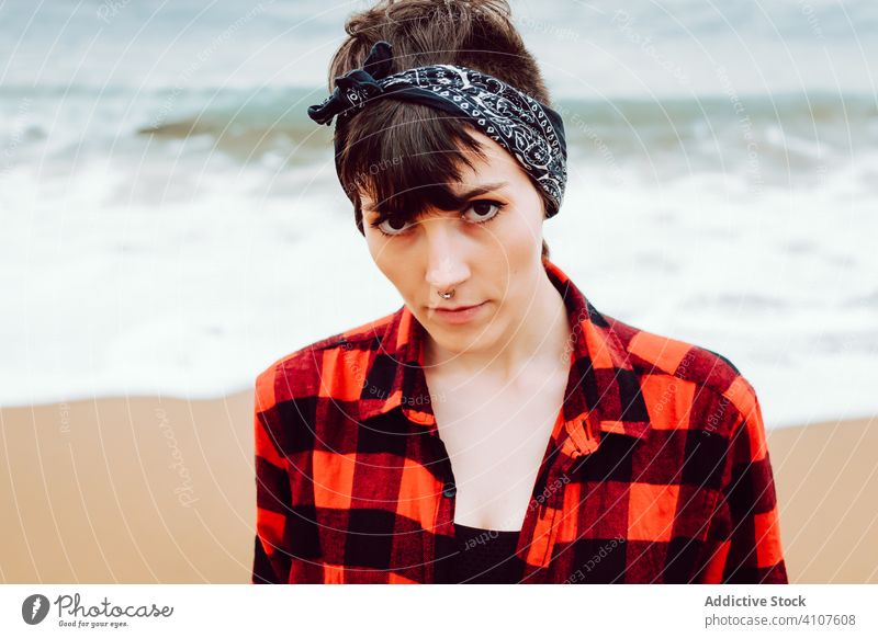 Woman standing on wet sand on beach woman footprint walk concept sea barefoot ocean female water nature travel coast seaside environment lonely overcast cloudy