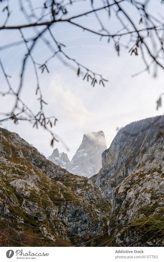 Rocky peak in cloudy haze in bright day mountain hill travel nature sky landscape stony tourism adventure scenery asturias europe stone spain vacation rock