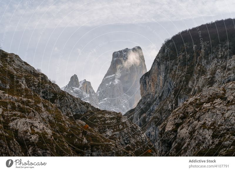 Valley in peaks under gray cloudy sky mountain rock valley rocky nature europe landscape scenic scenery park asturias spain natural serene stone season journey