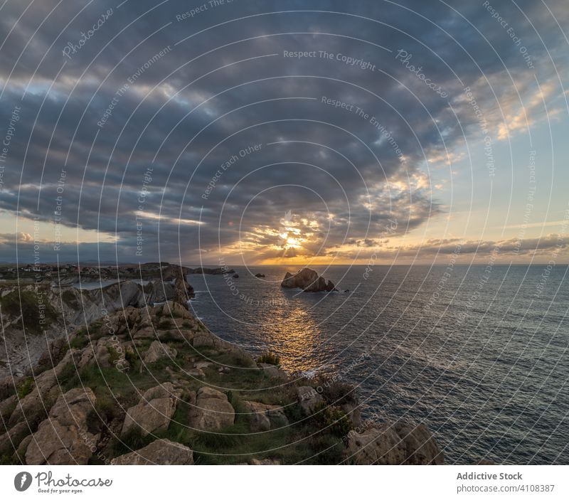 Peaceful landscape of rocky cove in sunset scenery peaceful sea skyline coastline nature water destination tourism seascape cliff stone holiday summer vacation