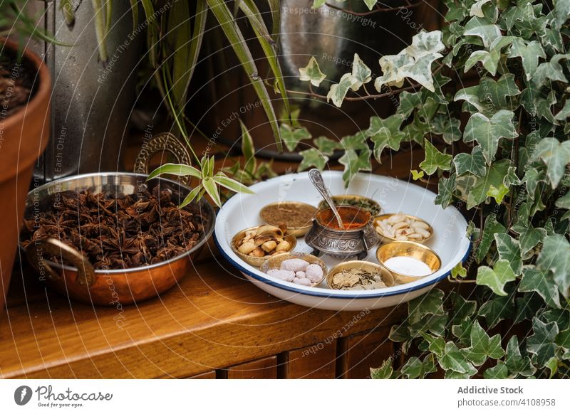 Anise stars and various spices on rustic table anise herb dried plant organic natural bowl set dry vitamin seasoning serve food ingredient pepper cinnamon