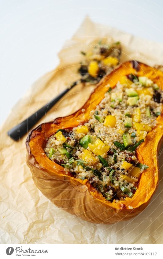 Vegan stuffed pumpkin with quinoa and vegetables vegetarian food filling cooking baked half squash vegan ingredient recipe butternut roasted orange seasonal