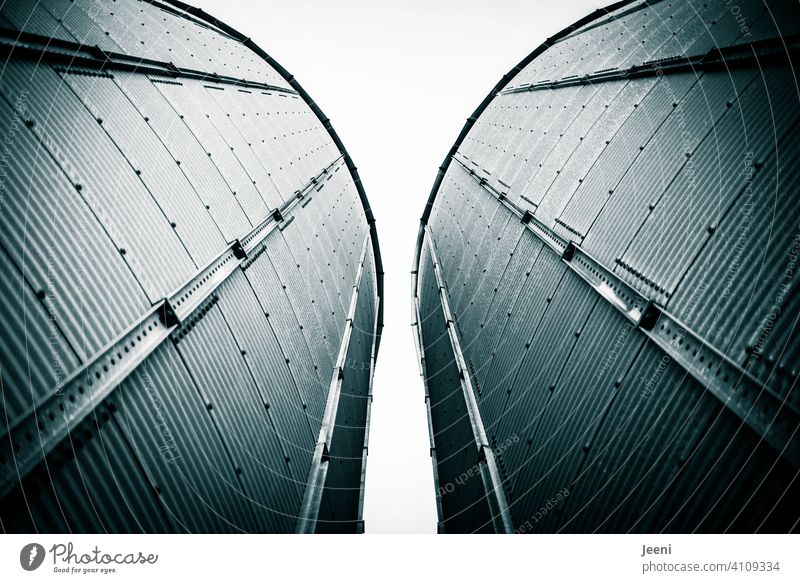 Two silos for the storage of grain at a port facility Grain silo Silo Silos bins Cylinder spires Tower Grain harvest Harbour huge Tall Worm's-eye view