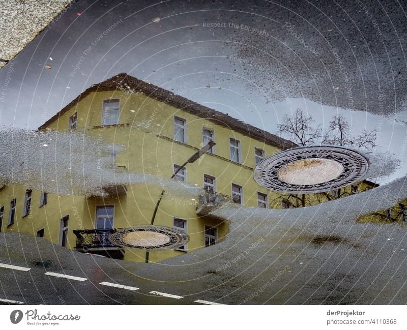 Neukölln in the reflection of a puddle Central perspective Reflection Shadow Copy Space top Twilight Artificial light Light Copy Space right Copy Space left