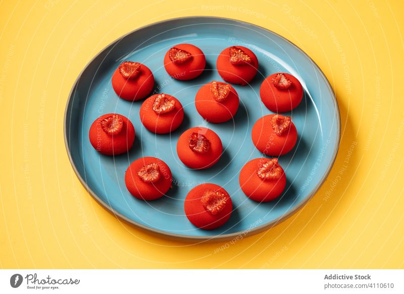 Bright red dessert on plate raspberry ball sweet food pastry colorful bright tasty cuisine dish delicious yummy scrumptious sugar calorie portion baked gourmet