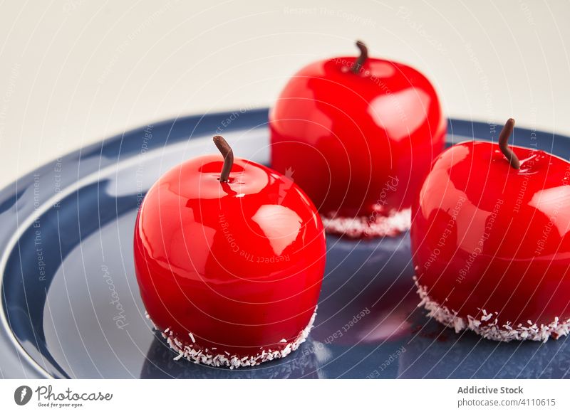 Apple shaped dessert on plate apple icing sweet food pastry tasty cuisine dish delicious yummy scrumptious sugar calorie portion baked gourmet prepared edible