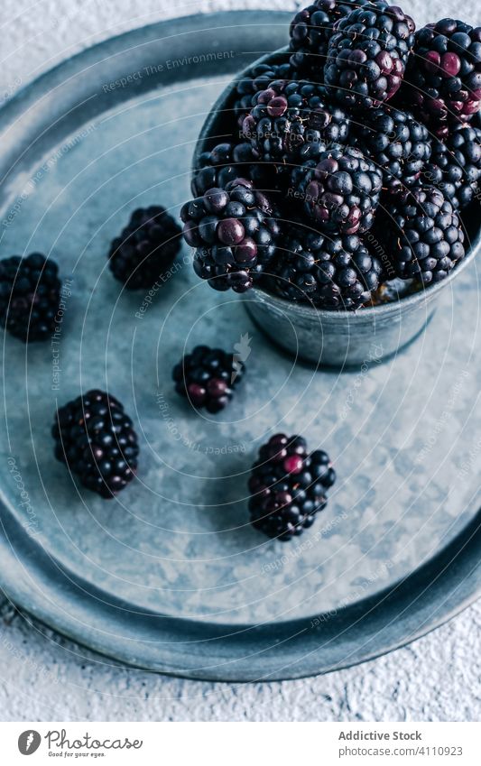 Fresh blackberries in cup and on tray blackberry fresh ripe rustic organic food sweet harvest delicious tasty dessert natural yummy ingredient healthy gourmet