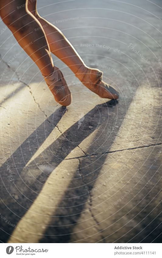 Ballerina in pointe balancing on tiptoes in studio ballerina leg hurt balance motivation practice exercise woman determine training endurance dance professional