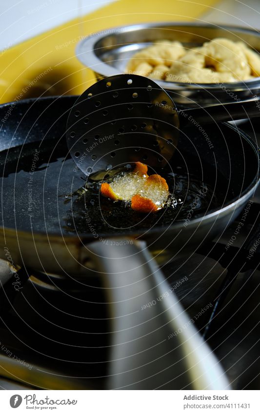 Yummy donuts frying in hot oil stove bubble cook skimmer cuisine food fresh delicious tasty meal gourmet prepare tradition kitchen culinary nutrition recipe