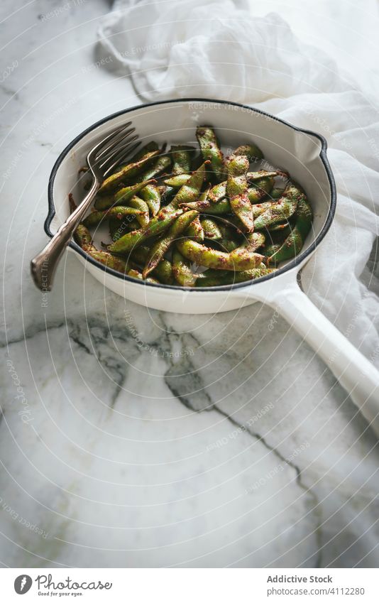 Bowl with edamame dish on table soybean bowl napkin food asian tradition delicious fresh gourmet meal cuisine seasoning tasty healthy vegetable vegetarian vegan