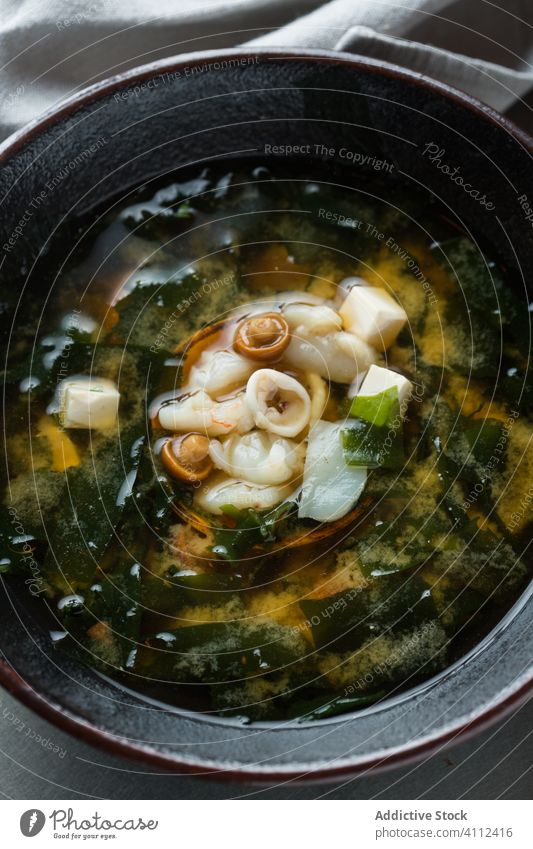 Dumpling soup with mushroom and tofu dumpling restaurant bowl table meal delicious food tasty dish cafe gourmet cuisine dinner fresh rustic lunch nutrition