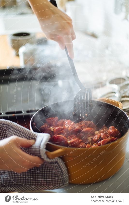 Woman preparing tomato sauce in kitchen cook homemade prepare housewife hot pan mix food meal cuisine delicious dish hand ingredient recipe culinary utensil