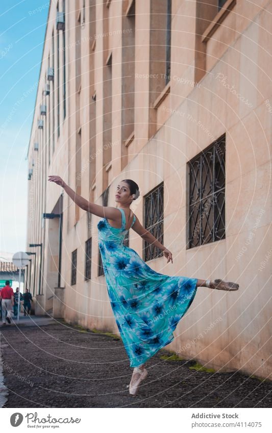 Young woman dancing on street dance ballet grace building concept young slim dress female elegant ballerina shabby city perform dancer exterior move flexible