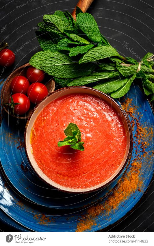 Homemade tomato soup with bread, mint and olive oil healthy food lunch tasty background nutrition vegan food traditional gourmet homemade spoon fresh