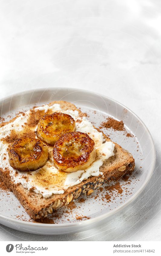 Homemade toasted bread with cream cheese, fried banana, honey an food sandwich fried plantain cinnamon healthy lunch snack breakfast meal gourmet vegetarian