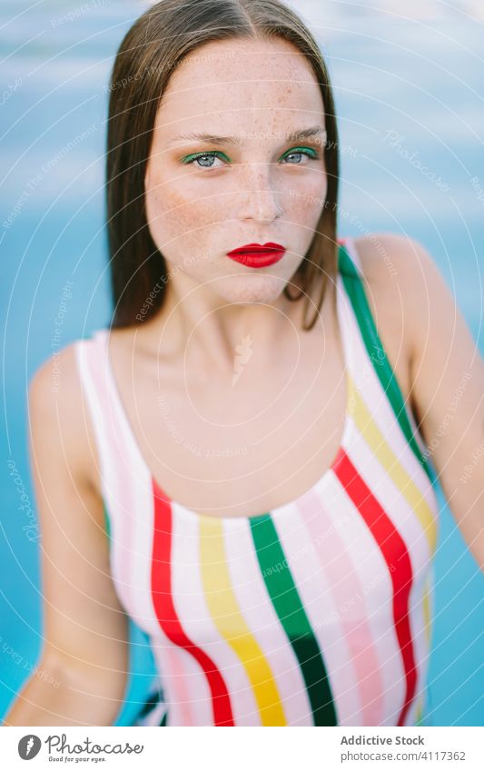 close-up of a brunette girl with long hair on a stairs in the pool water blue leisure teenager young female woman person summer fun people beautiful swim wet