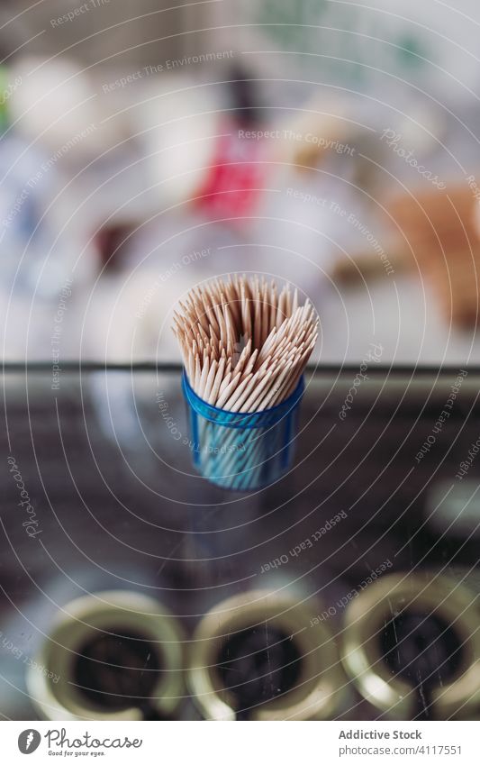 Sticks toothpicks on blurred background wood small stick wooden shape hygiene health clean dental care sharp many eat pointer little mini brown bamboo accessory