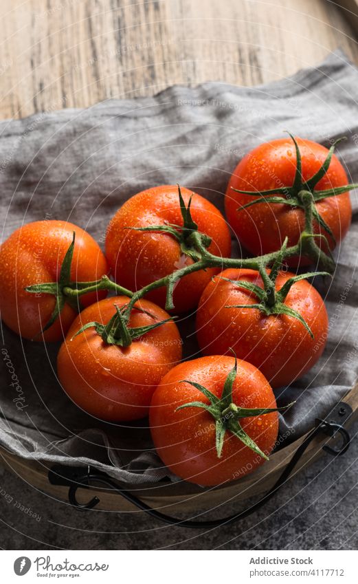 Clean tomatoes on cloth napkin clean wet healthy table ingredient food rustic fresh natural organic vegetable vegetarian diet vegan vitamin nutrition fabric