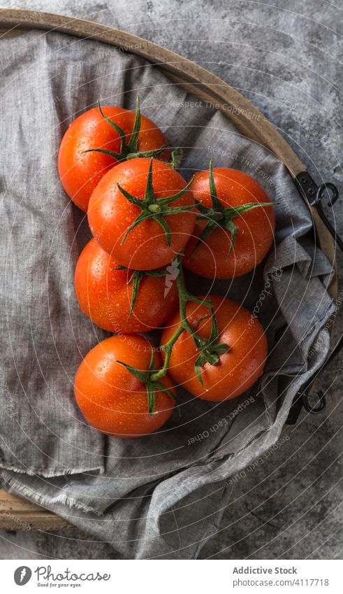 Clean tomatoes on cloth napkin clean wet healthy table ingredient food rustic fresh natural organic vegetable vegetarian diet vegan vitamin nutrition fabric