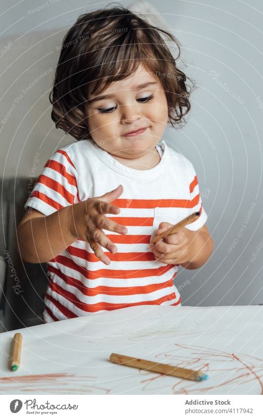 Focused little kid drawing at table education pencil creative preschool colorful cute boy learn childhood adorable play casual activity kindergarten concentrate