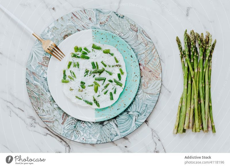 Egg white omelet with asparagus served on plate fork marble table fresh food tasty healthy meal delicious dish organic yummy lunch gourmet cuisine green dinner