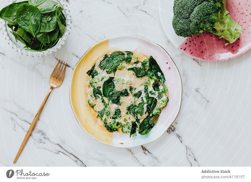 Broccoli salad with spinach and cheese broccoli plate fork marble table fresh serve food tasty healthy meal delicious dish organic yummy lunch gourmet cuisine