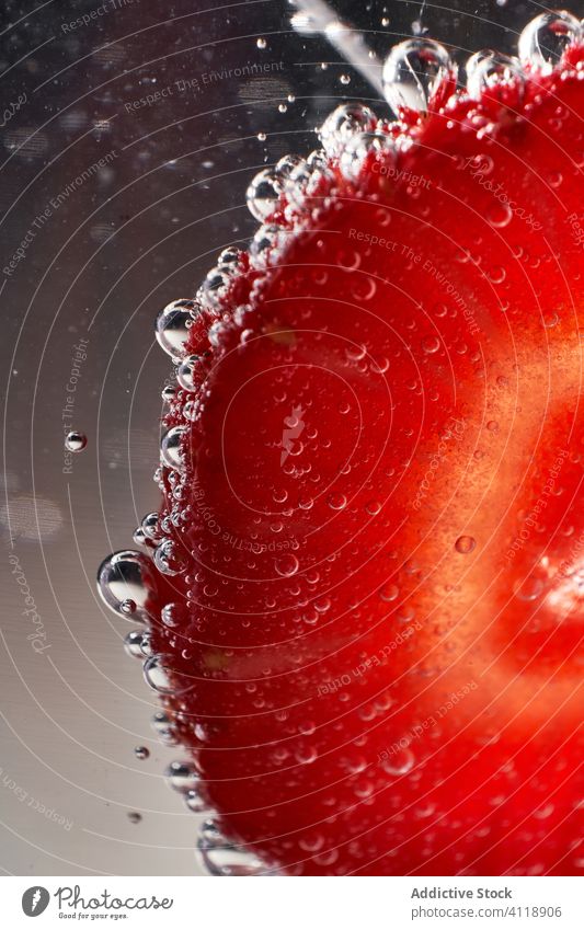 Fresh strawberry in clean water air bubble fresh ripe summer red green transparent clear food fruit drop drink dessert splash cold wet liquid organic season